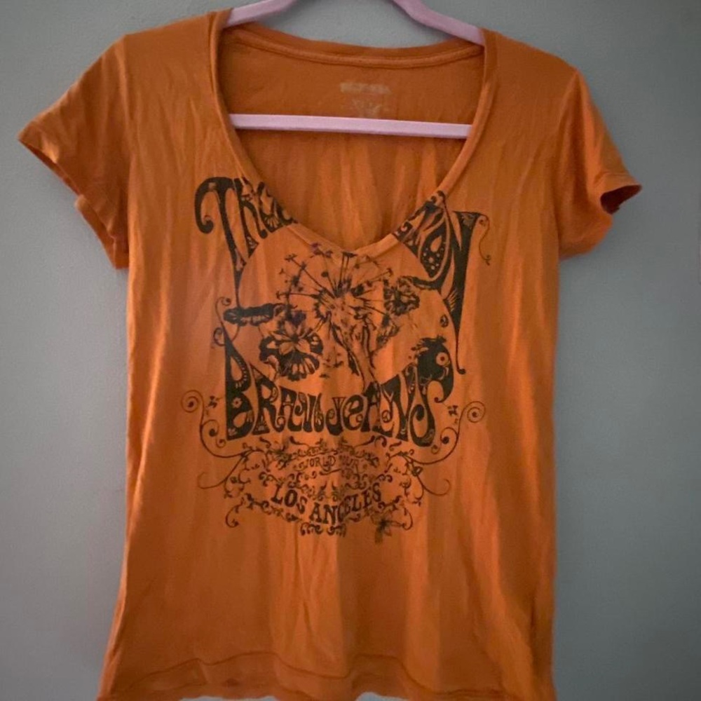 True Religion vintage v neck top, top does have a small hole on the neck line.